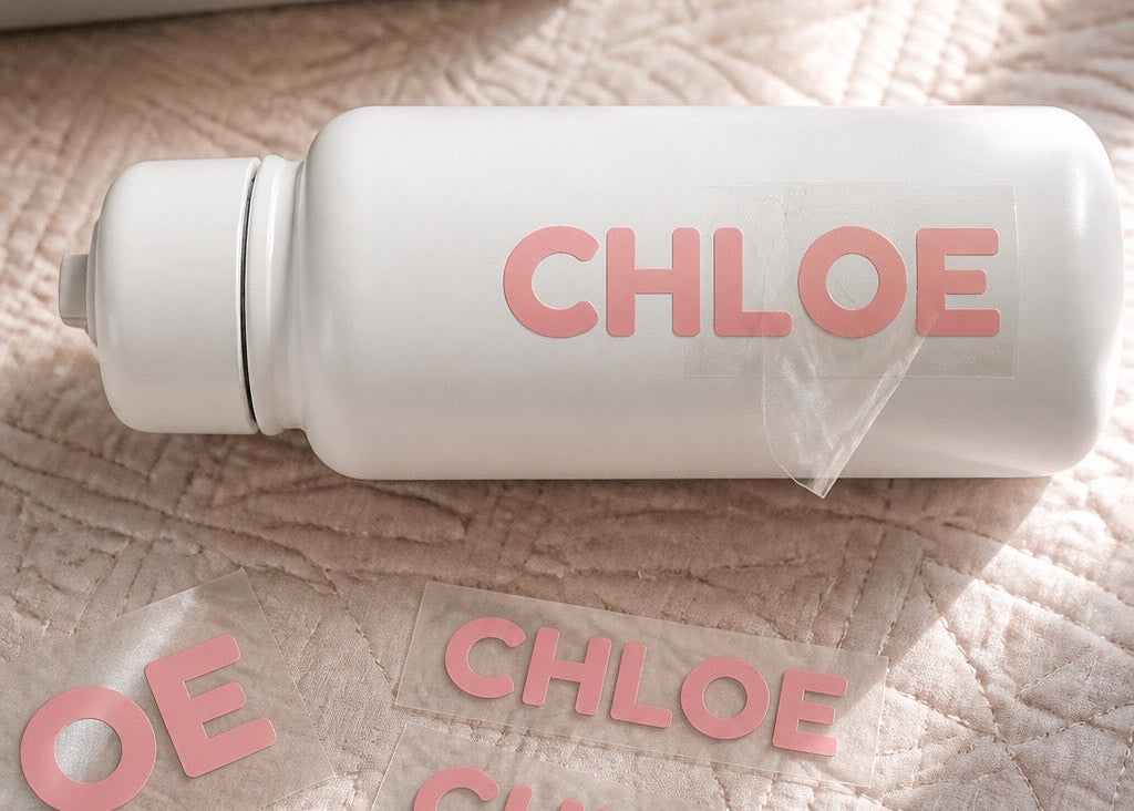 Load video: A short demonstration showing how to apply a Chlosha UV DTF label by cleaning the surface, pressing the design firmly, and slowly peeling away the clear transfer film.